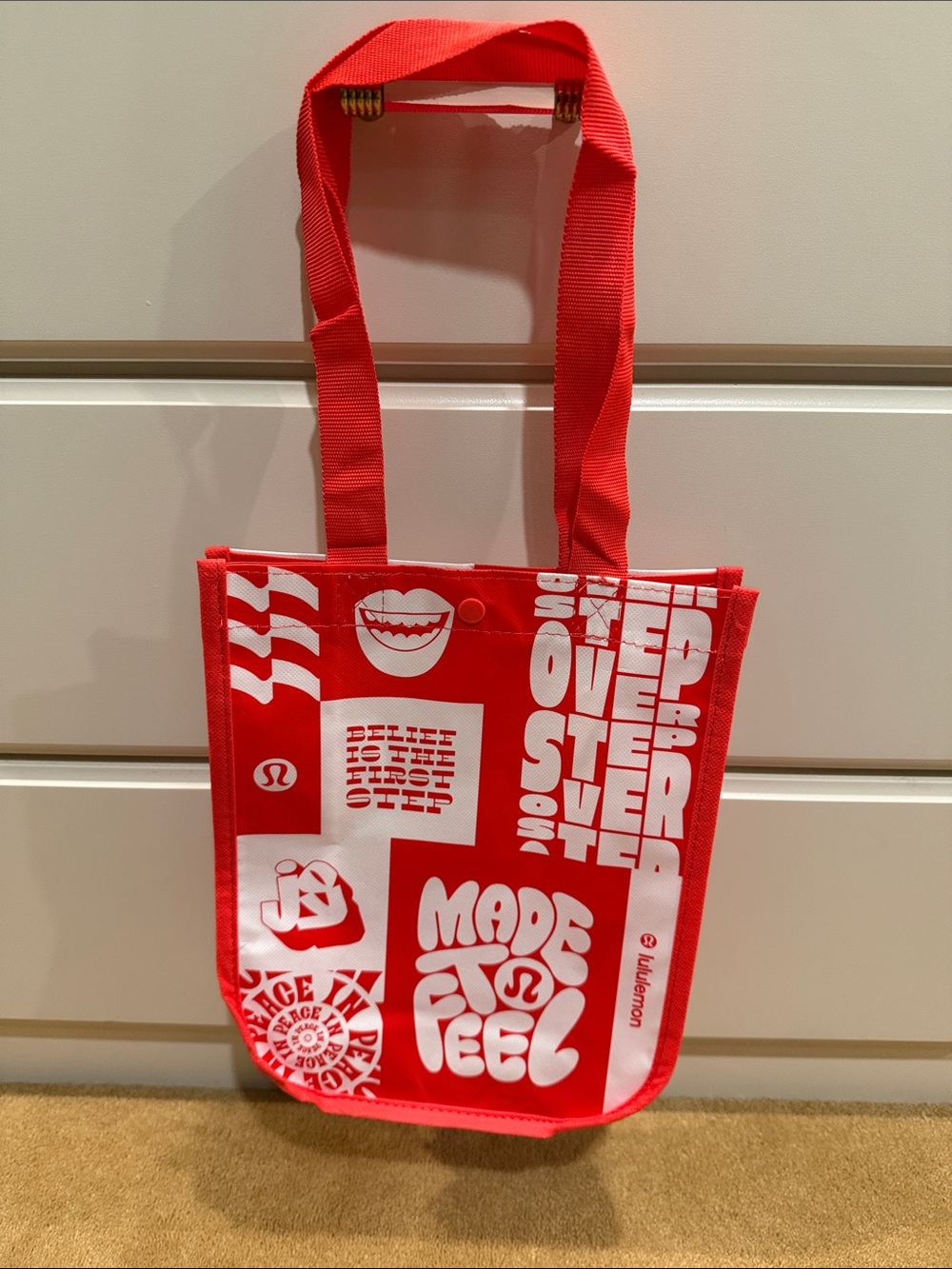LULULEMON ATHLETICA RED AND WHITE "MADE TO FEEL" REUSABLE TOTE BAG
